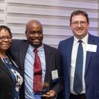 Quincy Williams poses with man and woman